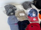 a lot of hats that are sitting on the floor