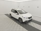 the small white car is parked in a clean room