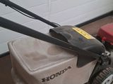 a lawn mower that is sitting in the garage