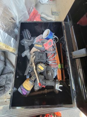 a black box with tools inside of it on the floor