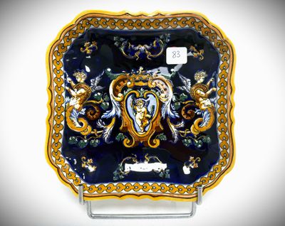 a blue and gold plate with an elephant on it