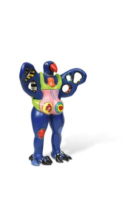 brightly colored figurine of a man holding a pair of scissors in his right hand
