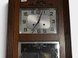 a clock that is hanging on the wall