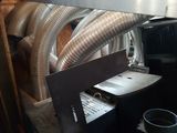 a machine that has a bunch of metal pipes on it