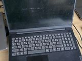 two laptops sitting on a table with a lot of wires