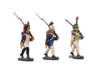 three figurines of men in uniforms with swords and uniforms