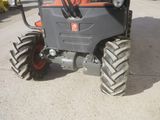 a tractor that is parked on the side of the road