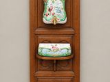 a picture of a wall mounted cabinet with a vase on it