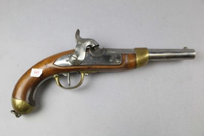 an old gun that is on display on a table