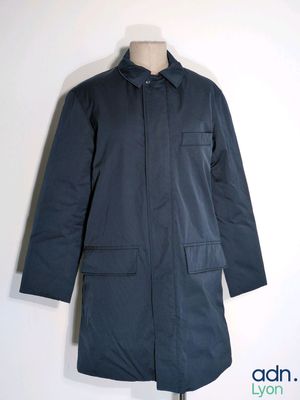 the coat is blue and has two pockets on the front