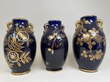 three vases that are sitting side by side on a table
