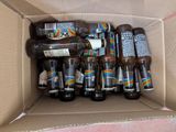 many bottles of beer in a box on the floor