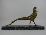 statue of a pheasant on a marble base on a white background