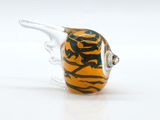 a glass bead with a tiger on it on a white surface