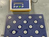a picture of a scale and some buttons on a table