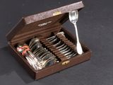 a box of silverware with a fork and spoon in it