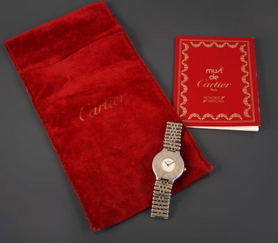 a lady ' s cartier watch with a red velvet pouch