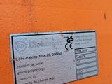 a label on the back of an orange bench