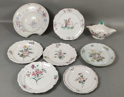 a group of plates and bowls with flowers on them