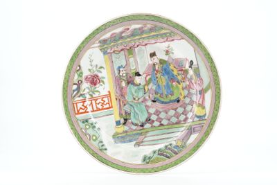 a plate with a picture of a man and woman on it