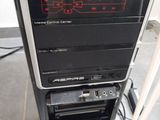 a computer tower that has a clock on top of it