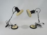 two black and white desk lamps on a white surface
