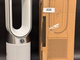 an image of a box with a white air purifier next to it