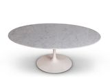 an image of a white marble table with a circular base