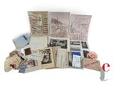 a pile of old postcards sitting on top of a table
