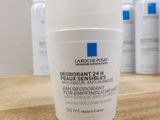a bottle of deodorannt 24h deodorannt deodorannt on a wooden table