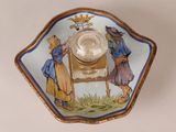 a small bowl with a picture of a man and a woman on it