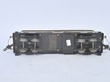 a black train car sitting on the tracks in the snow