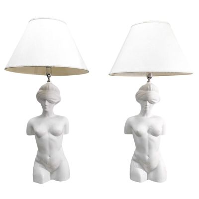pair of white ceramic table lamps with female torsos and lampshads