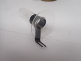a plastic cup and a pair of pliers on a table