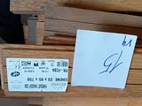 several pieces of wood are stacked on top of each other with a price tag