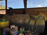 a large tank of gas sitting next to some other items