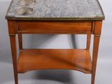 une vieille table en bois avec un plateau en marbre et un évier en métal