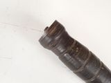 a black pipe that is on a white surface