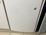 a white dishwasher sitting in a kitchen next to a counter