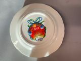 a white plate with a christmas ornament on it