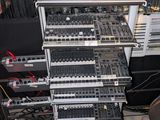 a rack of electronic equipment in a music studio