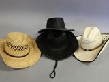 three hats are lined up on top of each other on a table
