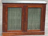 a wooden cabinet with two glass doors and a marble top