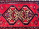 an image of a red and blue rug with a design on it