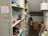 a room with a lot of shelves and boxes on the shelves