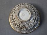 a picture of a white and gold plate with a picture on it