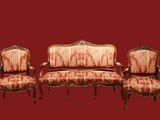 three chairs and a couch sitting next to each other on a red background