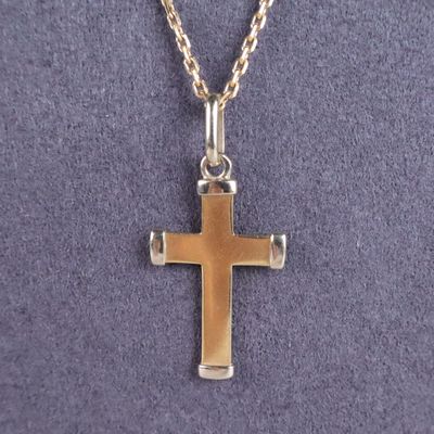 a close up of a cross on a necklace on a mannequin mannequin mannequin mannequin mannequin mannequin mannequin