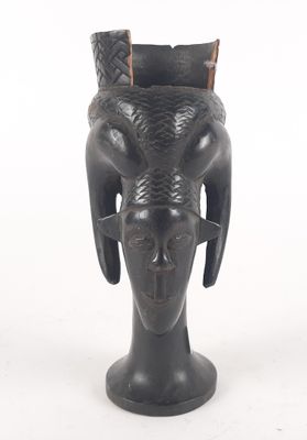 an image of a black vase with horns on it