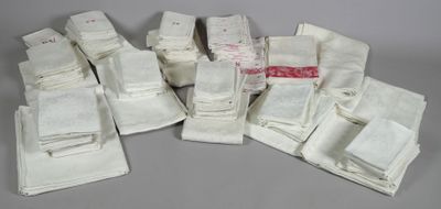 a pile of white towels on a gray surface